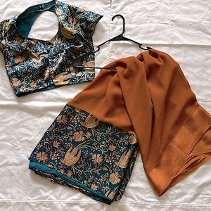 Deep tan and turquoise pattern saree. Indian Pakistani wear.